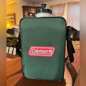 Vintage Coleman 2 qt water bottle with removable green insulated cover.
